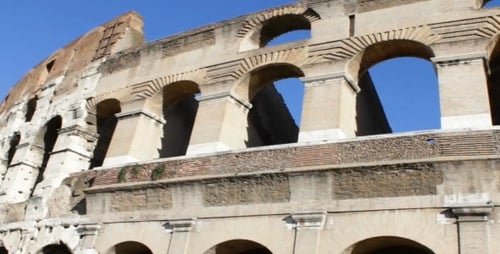 Exterior of Colosseum in Rome on Sunny Day