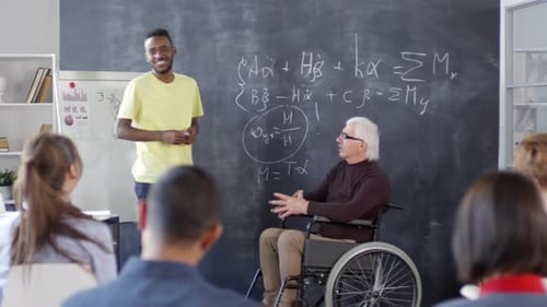 Diverse Professor Teaching Class with Teacher in Wheelchair