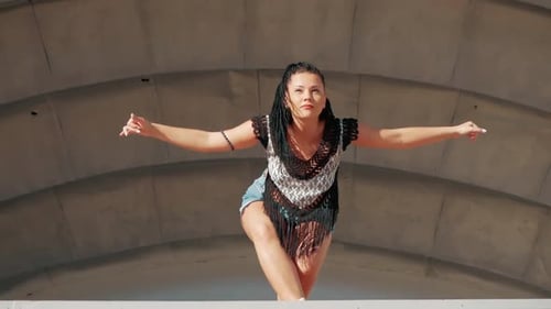 Woman Dancing in Denim Shorts Outdoors