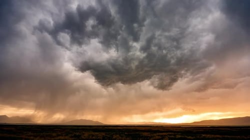 Storm clouds building at sunset