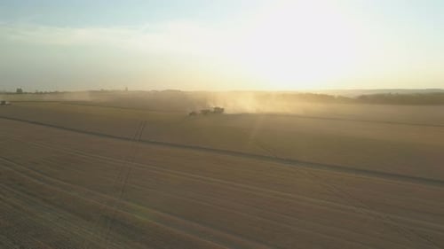 Top Down View of Harvester Machine Working in Wheat Field . Combine Agriculture Machine Harvesting