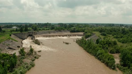 Aerial Drone View. River Water Move Down From with a Water Filled Dam After Heavy Floods and Rains