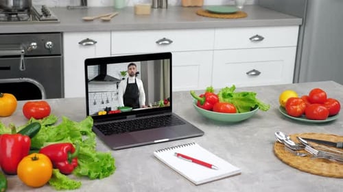 Cooking Tutorial on Laptop with Fresh Vegetables