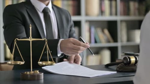 Close Up Shoot of Lawyer Hand Shaking and Signing Document in Court Room