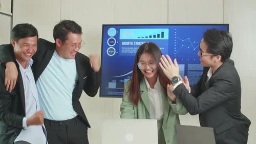 Team Celebrating Success at the Office