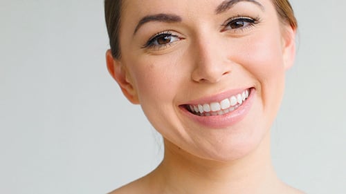 Smiling Woman Posing in Studio Close Up