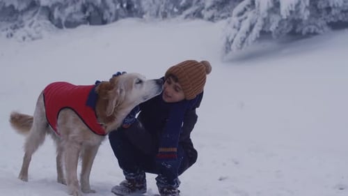 Kids loving their dog on winter day.