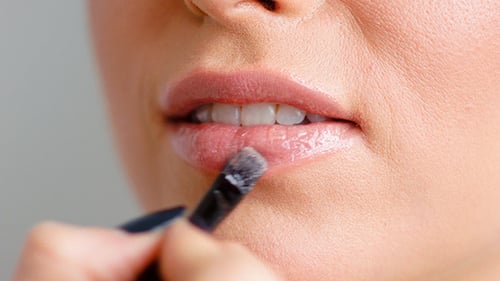 Applying Lipstick with Brush for Perfect Beauty