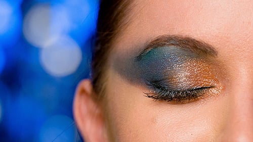 Woman Wearing Dark Shimmering Eyeshadow and Eye Liner