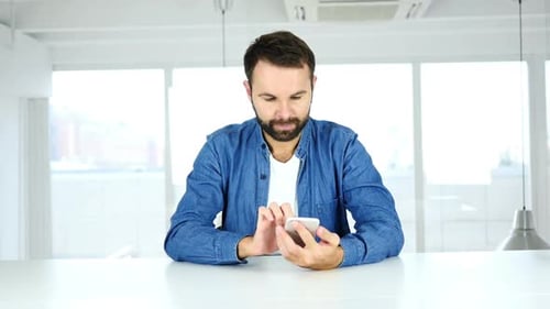 Man Using Smartphone Text Messaging Browsing