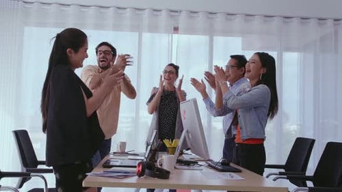 Successful Business People Celebrating Project Success at Office