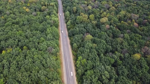 Asphalt straight road with Traffic cars driving
