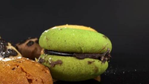 Colorful Macaron French Macaroon Rotating On A Black Background