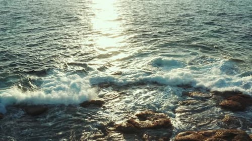 Glaring and Fresh Sea Surf Against a Beautiful Sunset