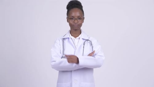 Confident Young Woman Doctor With Arms Crossed