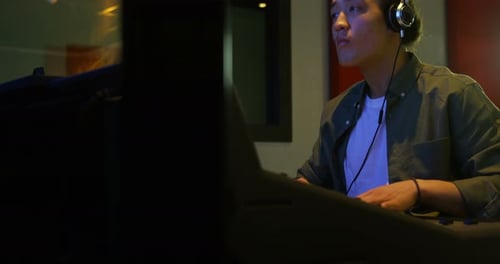 Male audio engineer using sound mixer