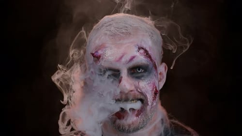 Creepy Zombie Exhaling Smoke in Dark Close-Up