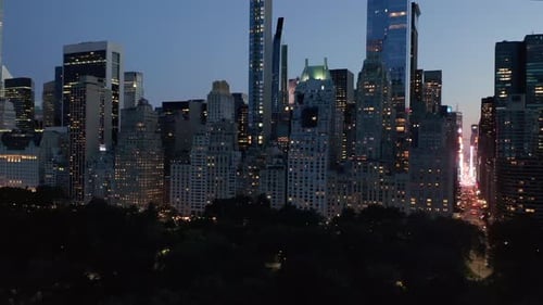 Manhattan Skyline at Night with Flashing City Lights in New York City at Central Park