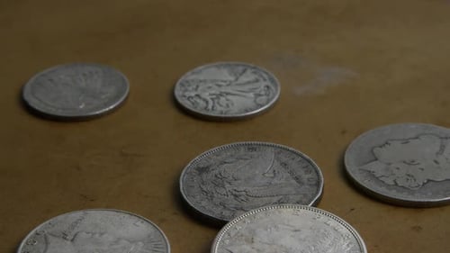 Rotating stock footage shot of antique American coins - MONEY 0051