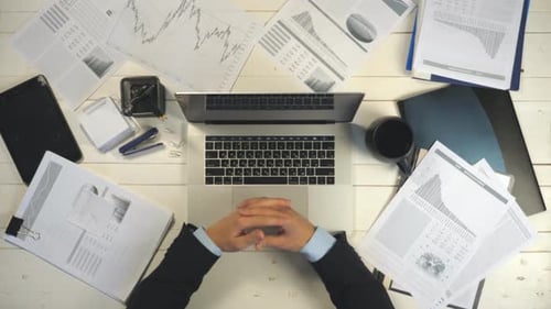Top View Hands of Businessman Typing Text on Laptop Keyboard at White Desk. Male Arms of Manager