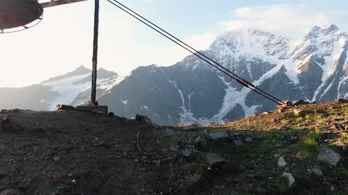 Drag Lift on Top of Mountain Against Snowy Peaks of Elbrus