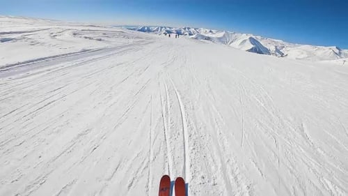 First Person View of Skiers Riding Downhill