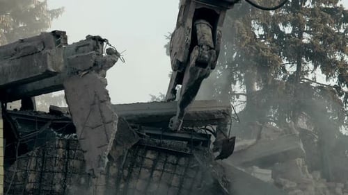 Strong Demolition Machine Removing House Ruins, Cleaning Up Earthquake Aftermath