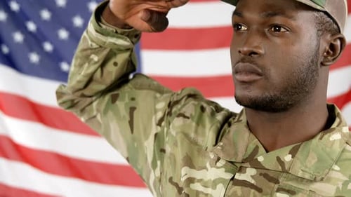 Soldier Saluting Against American Flag Background