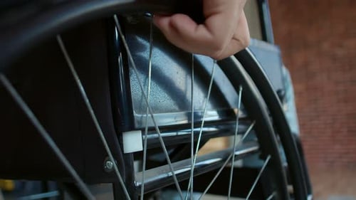 Close up of Wheelchair Wheel Being Pushed