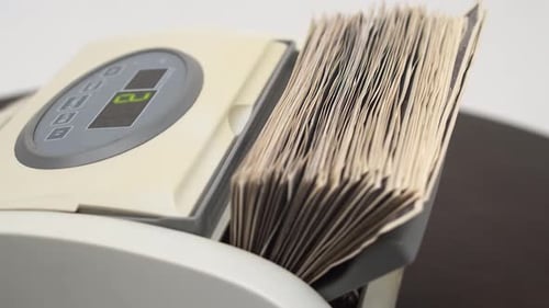 Automatic Machine Counts US Dollar Bills