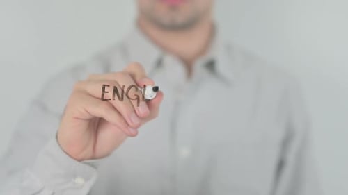 Man Writes English for Beginners on Glass