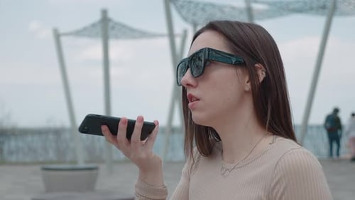 Woman Using Voice Command on Smartphone