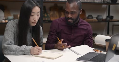 Design Team Collaboration at Workplace Table