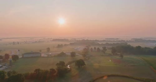 Aerial View with Beautiful Misty Sunrise Landscape Foggy Morning at Scenic Meadow
