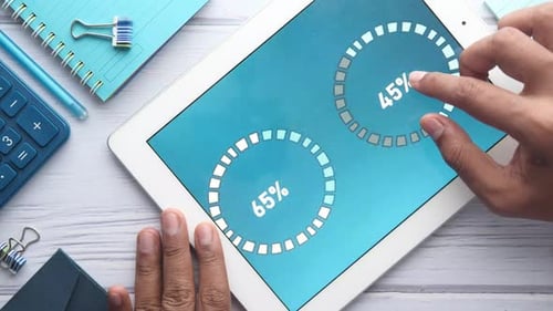 Man's Hand Working on Digital Tablet at Office Desk, Using Self Created Chart