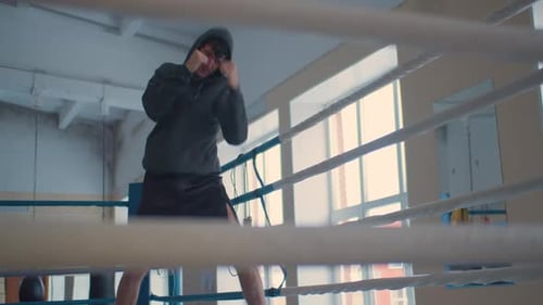 Young Man Boxing in an Urban Gym