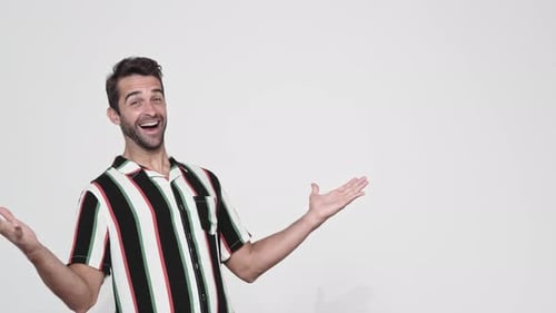 Man in Striped Shirt Clapping and Presenting
