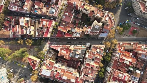 Aerial drone view of Barcelona, Spain. Blocks with multiple residential buildings, roads with cars