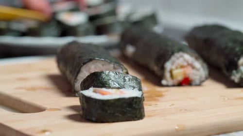 Slicing Delicious Sushi Rolls at Home