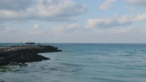 A blue emerald sea and waves with a horizontal line