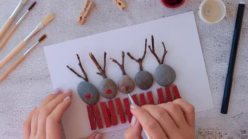 Making Diy Merry Christmas Deer on Greeting Card Postcard Made of Pebbles Sea Stones Clothespins and