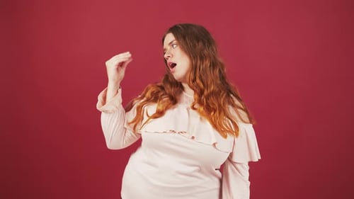 Young Woman Gesturing to Stop and Indicate Small