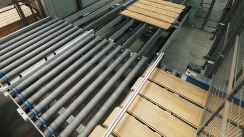 Floorboard production in the industrial factory. Manufacturing of a parquet board.
