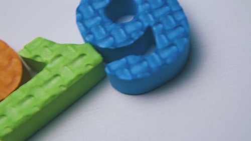 Colorful Foam Numbers Arranged Macro Shot