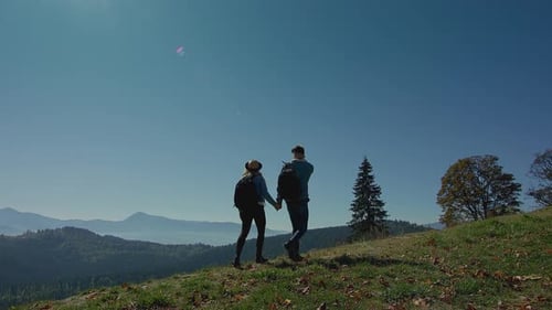 Couple Hiking in Beautiful Mountain Landscape