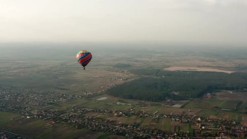 Hot Air Balloon Flies Over Rural Countryside