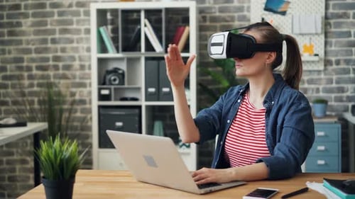 Woman Using VR Headset in Home Office