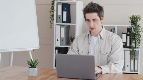 Caucasian Focused Business Man Boss Leader Freelancer Entrepreneur Office Worker Sitting at Table