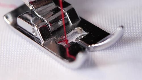 Sewing Machine Needle Stitching White Fabric