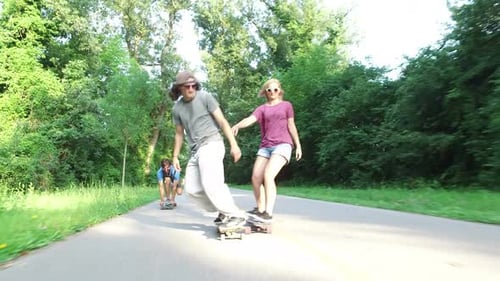 Close view of man skateboarding with friends